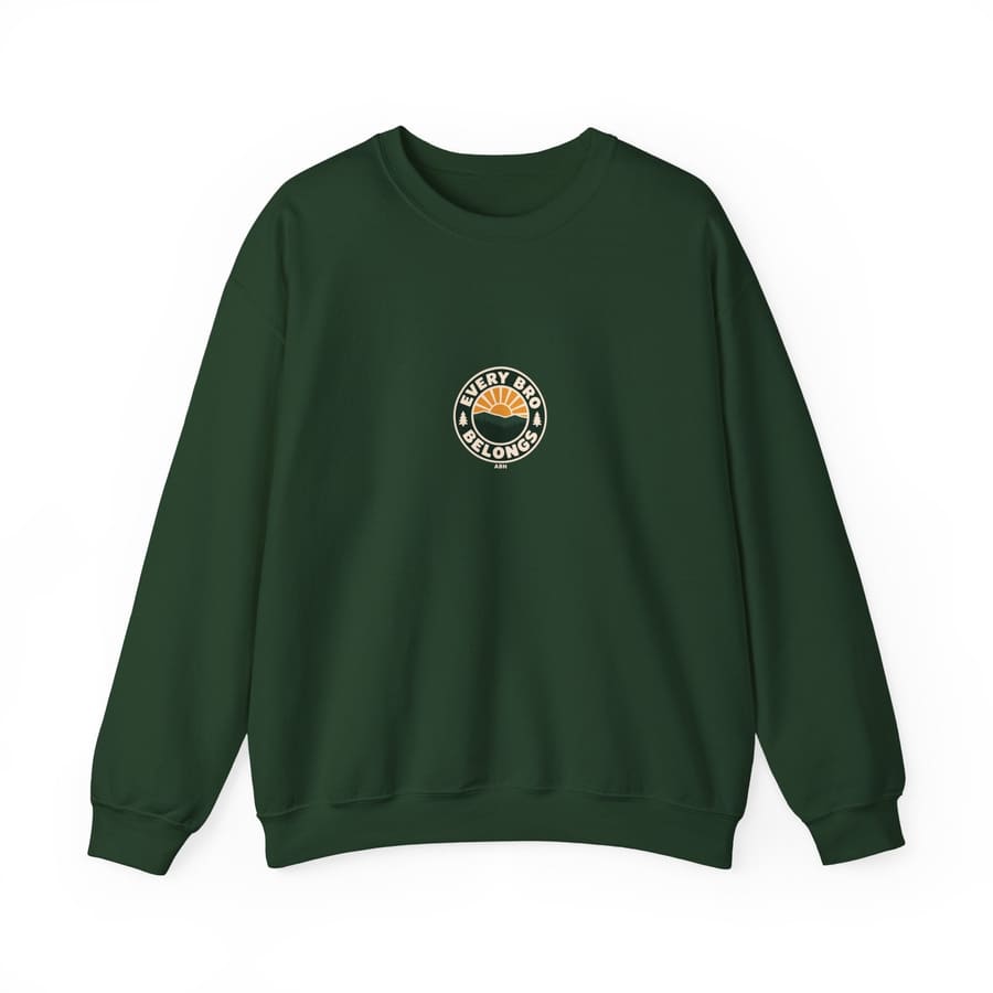Front product mockup of a forest-green ABH crewneck sweatshirt with a small centered Every Bro Belongs sunrise-and-forest badge and ABH signature.